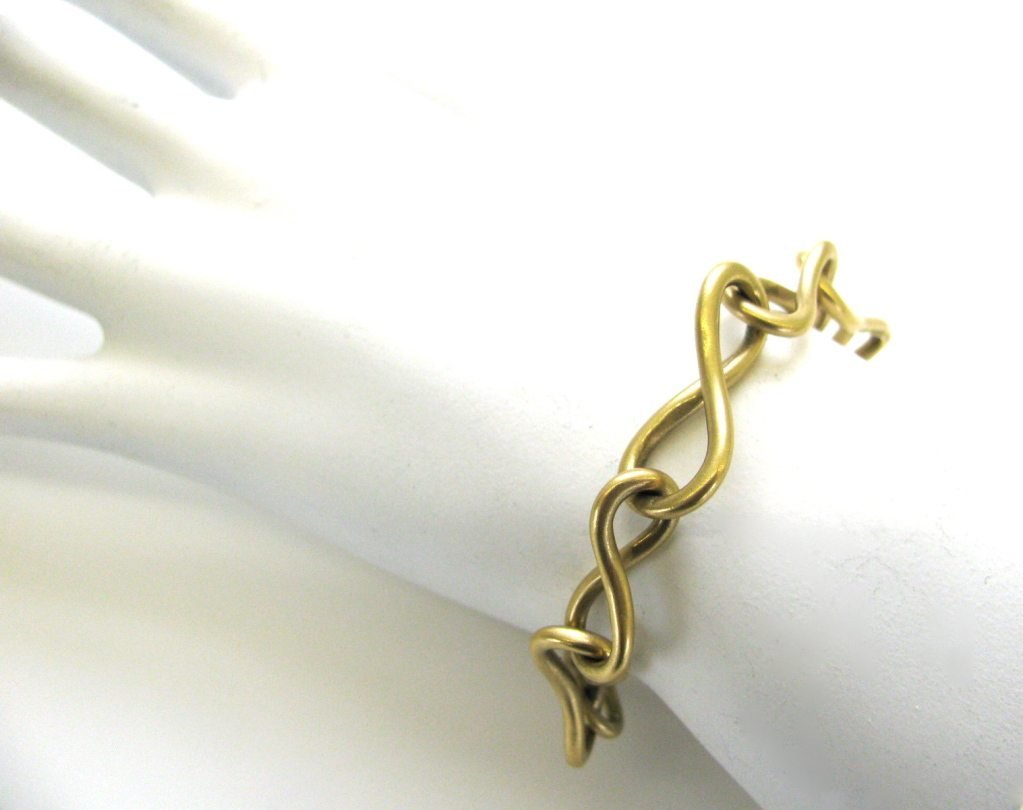 ANGELA CUMMINGS , A Gold Link Necklace/Bracelet Combination